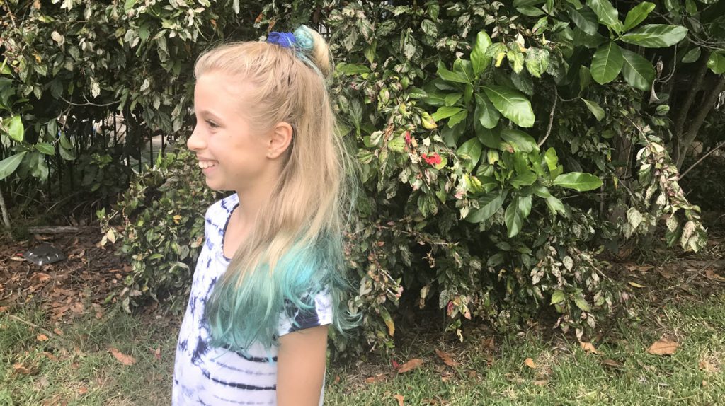 blonde girl with temporary blue hair dye